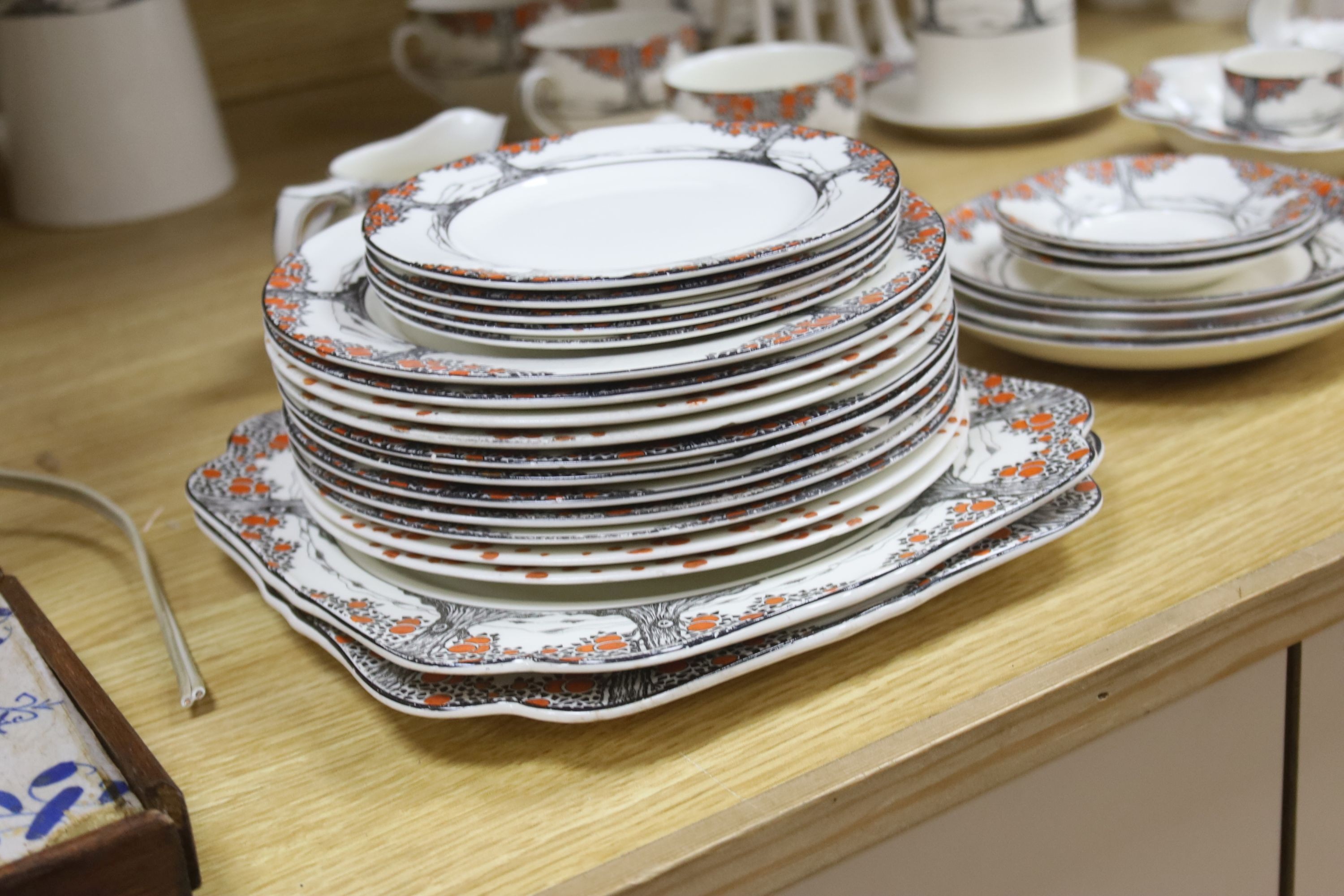 A Crown Ducal Art Deco 'Orange Tree' breakfast, tea and coffee service, to include a biscuit barrel, cheese dish and toast rack